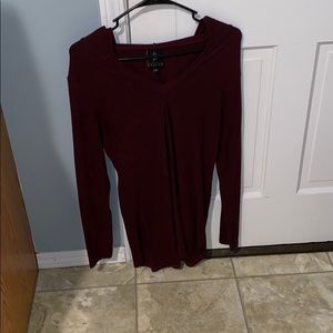 Hooded long sleeved maroon shirt